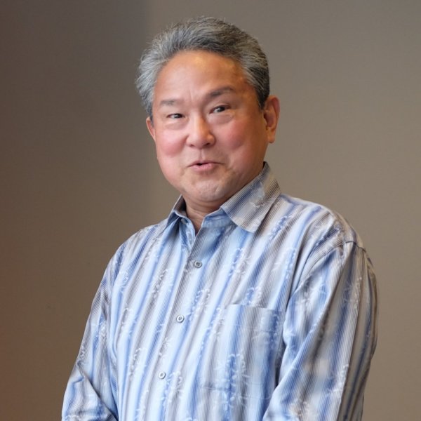 音楽家・谷川賢作さん。コンサートでは鍵盤ハーモニカを吹くこともある